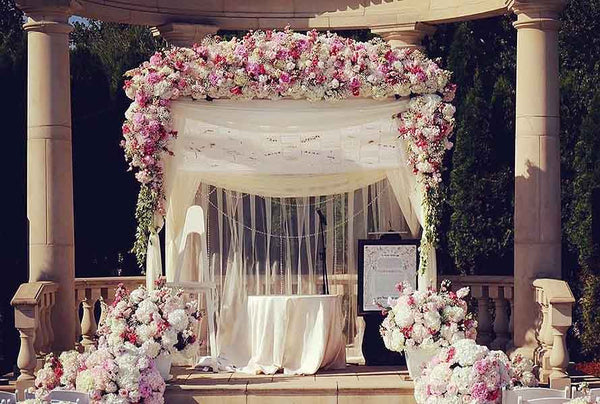 Four Designers Share Floral Wedding Arbor Decorating Tips